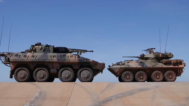 Rheinmetall Boxer CRV on the live fire range with an in-service Army Australian Light Armoured Vehicle (ASLAV).