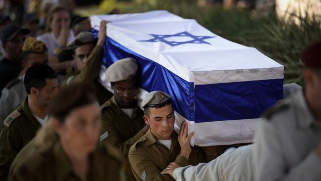 Soldiers carry the coffin of Israeli soldier Corporal Noa Marcian at Modi'in Military Cemetery. Picture: Getty