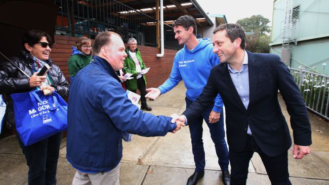 Matthew Guy and Nick McGowan shake hands with volunteers during the 2022 Federal Election. Picture: NCA Newswire/David Caird