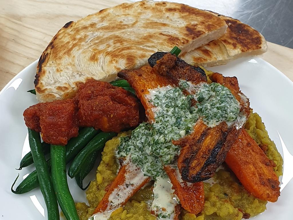 Tandoori roast carrots with spicy tomato and green bean kasundi and moong dal with roti paratha. Picture: Qantas