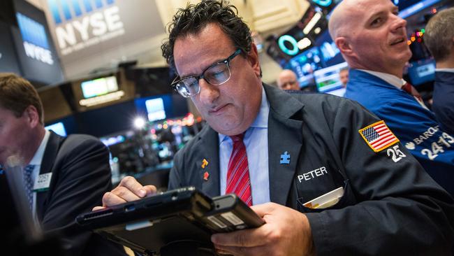 NEW YORK, NY - DECEMBER 04: Traders work on the floor of the New York Stock Exchange during the afternoon of December 4, 2015 in New York City. The market closed more than 370 points up due to positive jobs report data. Andrew Burton/Getty Images/AFP == FOR NEWSPAPERS, INTERNET, TELCOS & TELEVISION USE ONLY ==