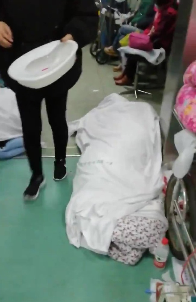 This footage allegedly shows a body underneath a sheet in hospital in Wuhan.