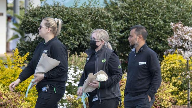 Mourners wearing Woolworths uniforms arrive at the funeral. Picture: NCA NewsWire / Simon Bullard