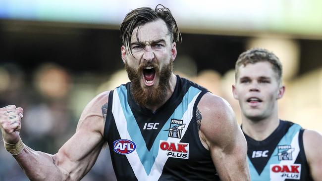 AFL - Port Adelaide v Fremantle at Adelaide Oval. Charlie Dixon celebrates a goal in the third quarter - Dan Houston coming in to celebrate Picture SARAH REED