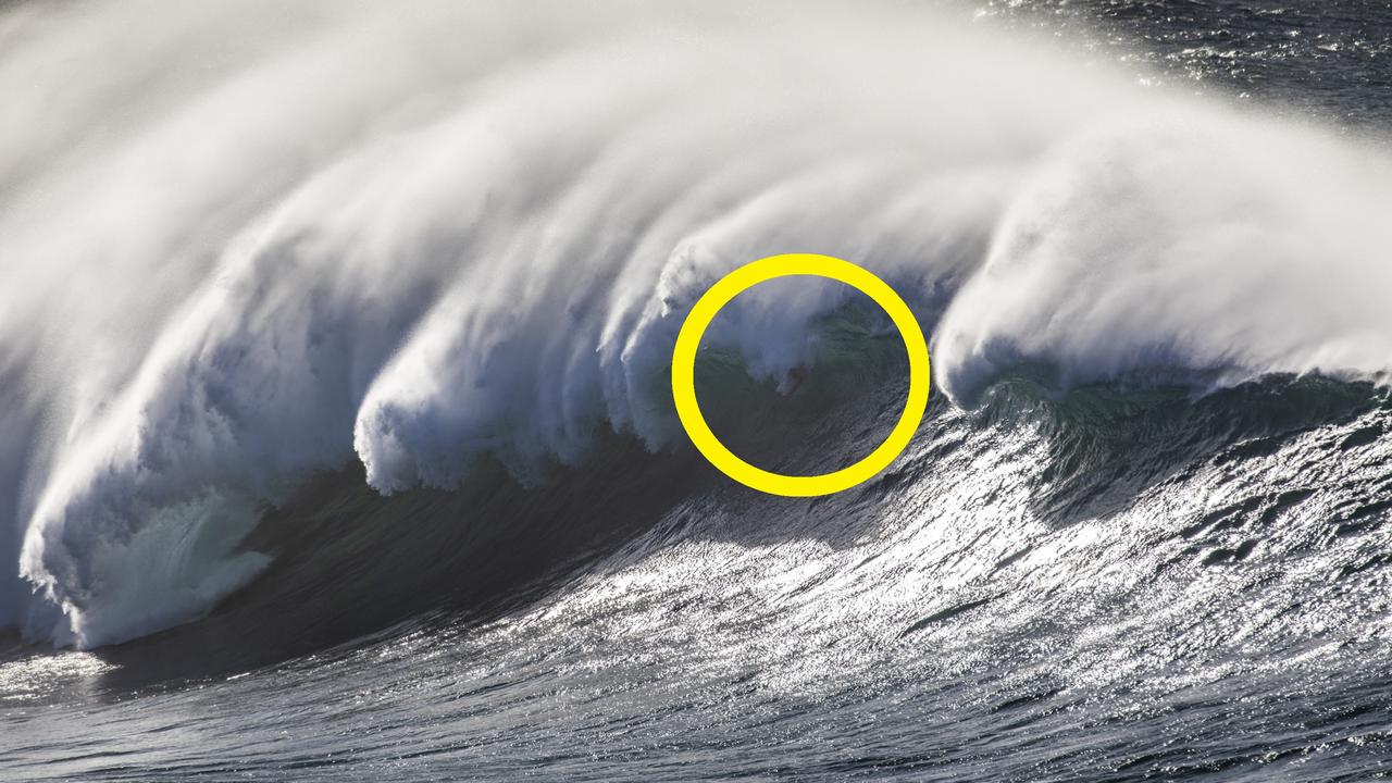 Legendary Brazilian waterman Kalani Lattanzi bodysurfs a 25ft Wedding Cake Island set wave during the peak of the swell. 8th May 2023. Photograph Dallas Kilponen