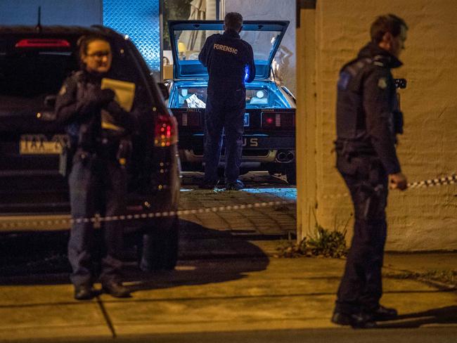 Police search for clues after two people were found dead inside a house in Kew. Picture: Jake Nowakowski