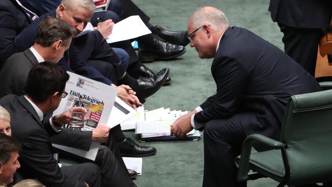 The Coalition took a moment to browse The Daily Telegraph during QT. Picture: Gary Ramage