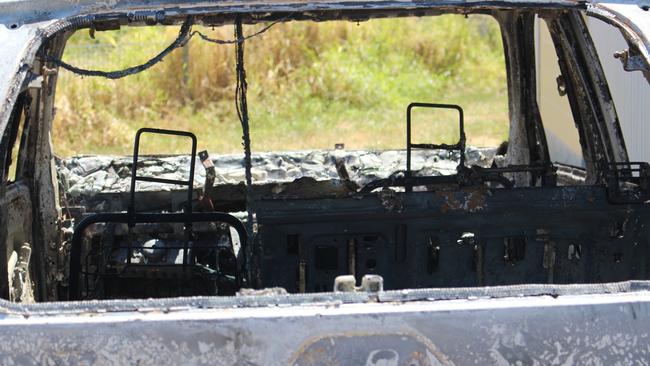 A burnt out car in Nauiyu/Daly River following rioting in April sparked by the Brisbane Lions loss to Collingwood in the 2023 AFL Grand Final. Picture: Jason Walls