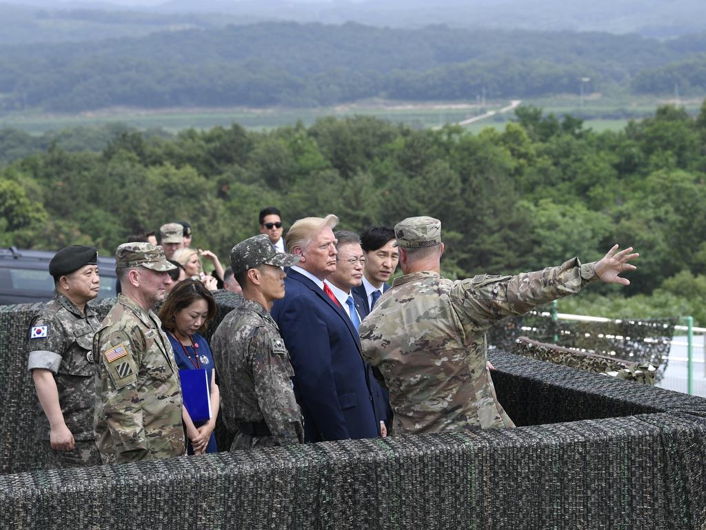 President Donald Trump views North Korea from the Korean Demilitarised Zone from Observation Post Ouellette at Camp Bonifas. Picture: Susan Walsh/AP