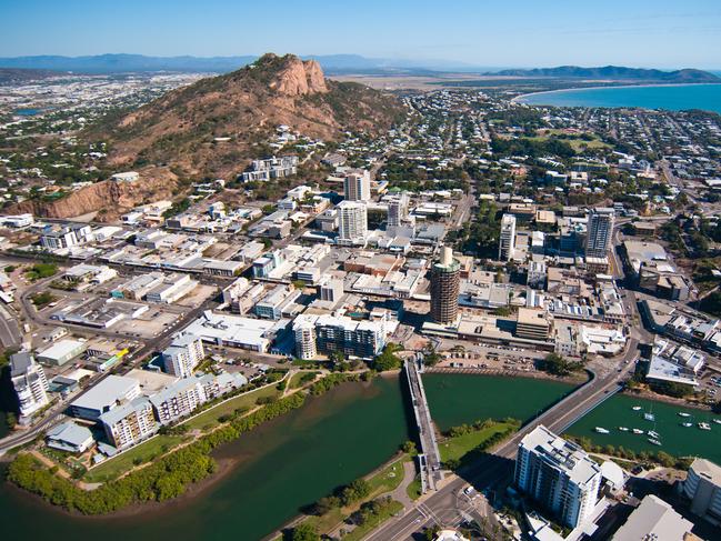 An aerial photograph of Townsville, looking across Ross Creek towards the CBD, Castle Hill and Rowes Bay.