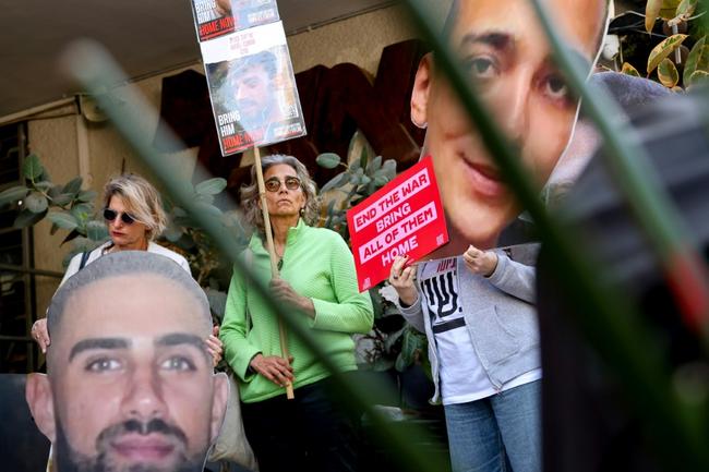 Mourners wait outside the morgue in Rishon LeZion in central Israel for the funeral procession of Ohad Yahalomi (pictured), one of the Israeli hostages taken captive by Palestinian militants in the October 2023 attacks