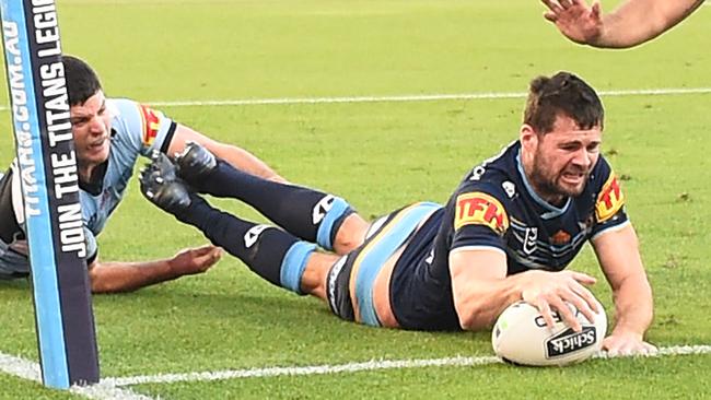 GOLD COAST, AUSTRALIA - JULY 04: Anthony Don of the Titans scores a try during the round eight NRL match between the Gold Coast Titans and the Cronulla Sharks at Cbus Super Stadium on July 04, 2020 in Gold Coast, Australia. (Photo by Ian Hitchcock/Getty Images)