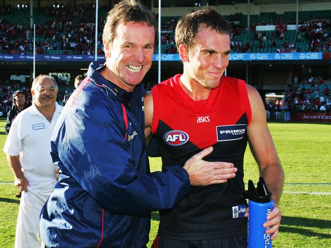 Neale Daniher, pictured with Cameron Bruce, was the last man to coach the Demons in a final.