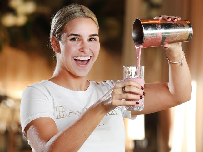 Pictured at Alex and Co in Parramatta is Naomi Borg pouring a milkshake.Research show that soy milk production is not great for the environment.Picture: Richard Dobson