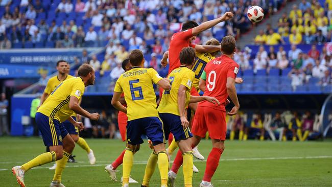 Harry Maguire of England rises above the pack to scores his team's first goal against Sweden. Photo: Getty Images