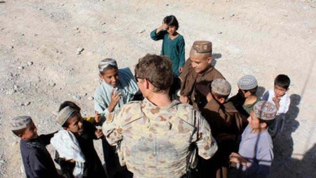 Andrew Hastie with local kids in Afghanistan.