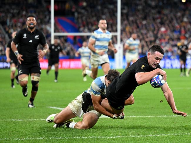 PARIS, FRANCE - OCTOBER 20:  Will Jordan of New Zealand breaks through a tackle from Juan Cruz MallÃÂ­a of Argentina to score his hat trick try and team's seventh try during the Rugby World Cup France 2023 semi-final match between Argentina and New Zealand at Stade de France on October 20, 2023 in Paris, France. (Photo by Shaun Botterill/Getty Images)