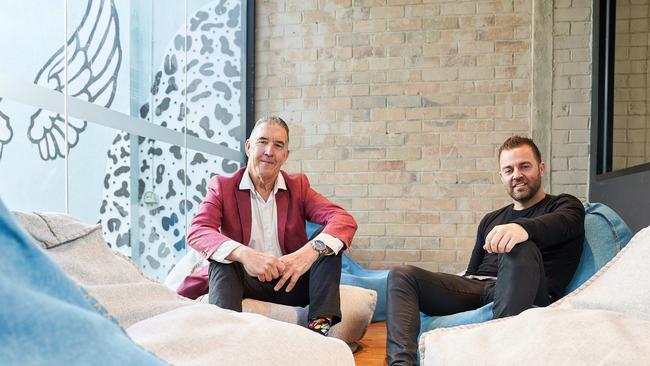 Geoff Harris, co-founder of Flight Centre, and Tobi Skovron, founder of Creative Cubes, in the Hawthorn office space. Picture: Stefan Postles