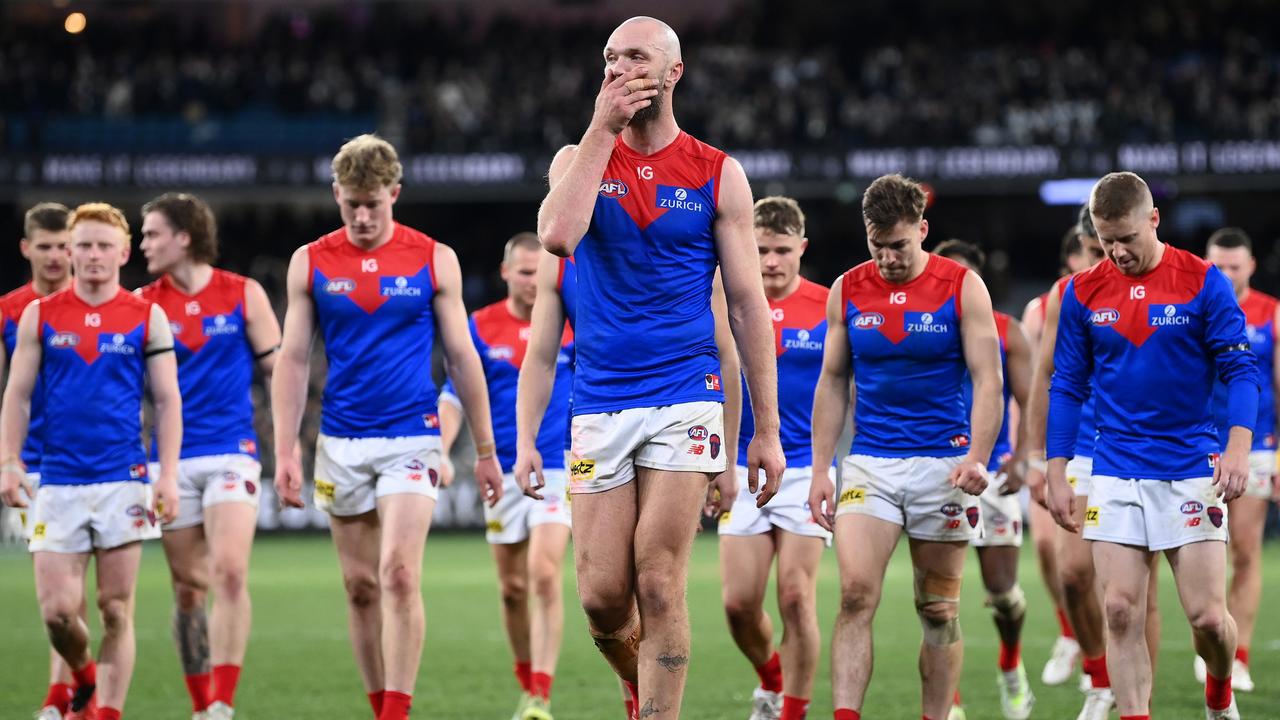 Max Gawn and his Demons teammates look dejected after losing the AFL First Qualifying Final match. Picture: Quinn Rooney/Getty Images