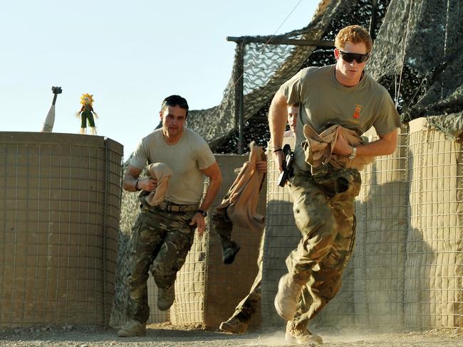 Prince Harry with fellow Pilots at the British controlled flight-line at Camp Bastion in Afghanistan's Helmand Province, where he was serving as an Apache Helicopter Pilot. Picture: John Stillwell