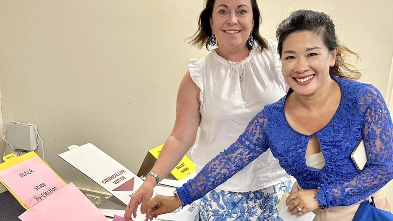 LNP Inala by-election candidate Trang Yen puts ballot papers in the box.