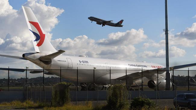 A China Eastern Airbus A330 passenger aircraft, awaits a new left engine at Sydney Airport. Picture: AFP/William West