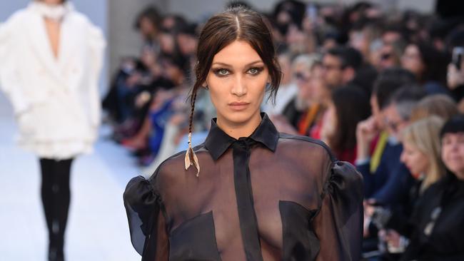 Bella Hadid wearing a trend of the moment – a messy up-do. Picture: AFP