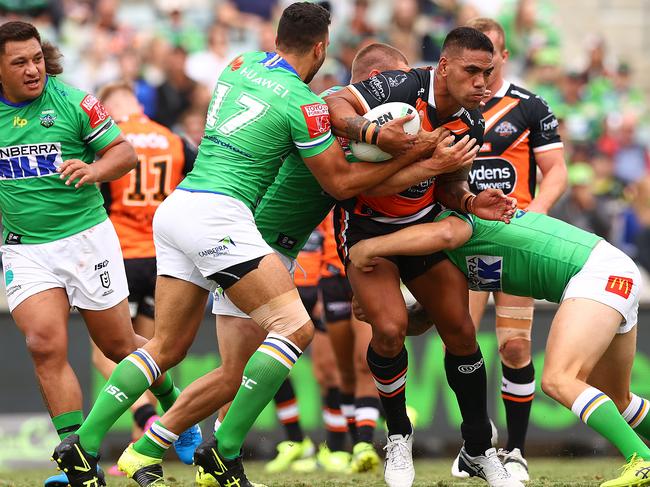 CANBERRA, AUSTRALIA - MARCH 14: Alex Twal of the Tigers is tackled during the round one NRL match between the Canberra Raiders and the Wests Tigers at GIO Stadium, on March 14, 2021, in Canberra, Australia. (Photo by Mark Nolan/Getty Images)