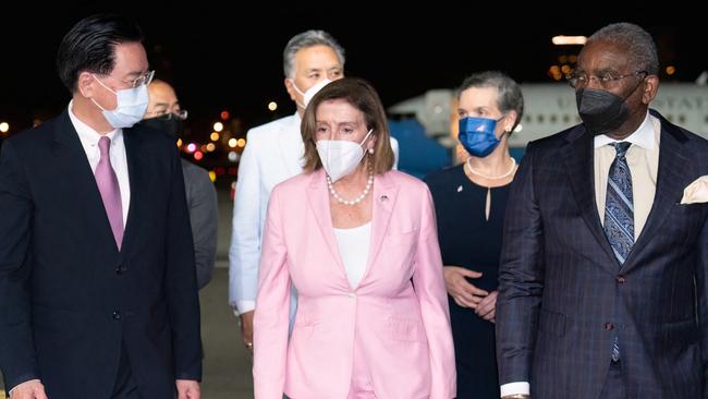 Nancy Pelosi is welcomed by Taiwanese officials on her arrival at Songshan Airport in Taipei. Picture: AFP.