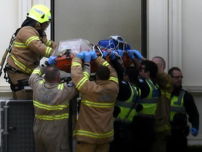 Incident at Government House - Emergency services arrive on scene.  A man is on the roof of Government house.  Picture: Nicole Garmston