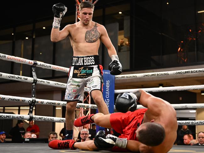 Dylan Biggs stands over Ryan Mitchem. Picture: No Limit Boxing.