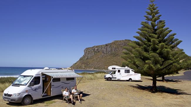 Campers relax near The Nut, at Stanley, in Tasmania’s North-West. Picture: Tourism Tasmania &amp; Adrian Cook