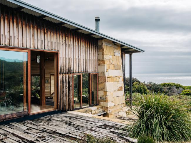 Roaring Beach House’s exterior which made of Buckland sandstone with external cladding of macrocarpa pine. Picture: Adam Gibson