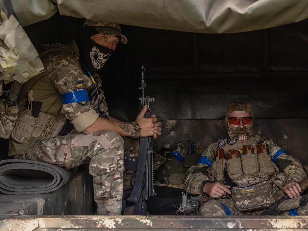 Ukrainian servicemen wait in a military vehicle to head for a combat mission, in the Sumy region, near the border with Russia. Picture: AFP