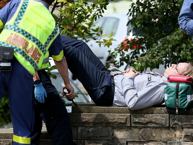 A Peacock Centre staff member is treated for smoke inhalation by paramedics. Picture: SAM ROSEWARNE.