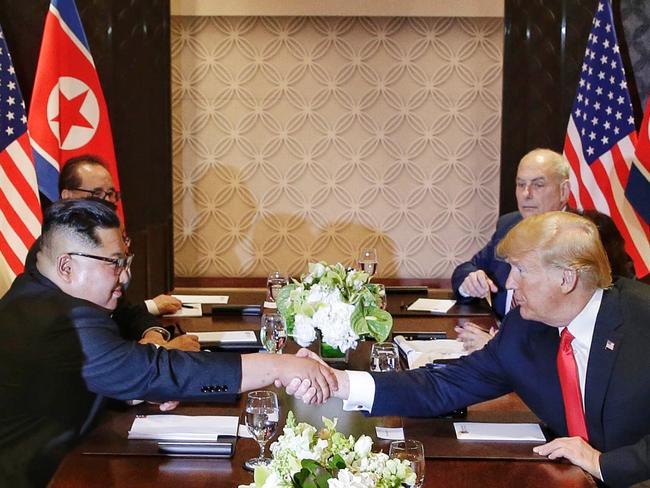 US President Donald Trump shakes hands with North Korean leader Kim Jong-un during their meeting at the Capella resort on Sentosa Island. Picture: AFP