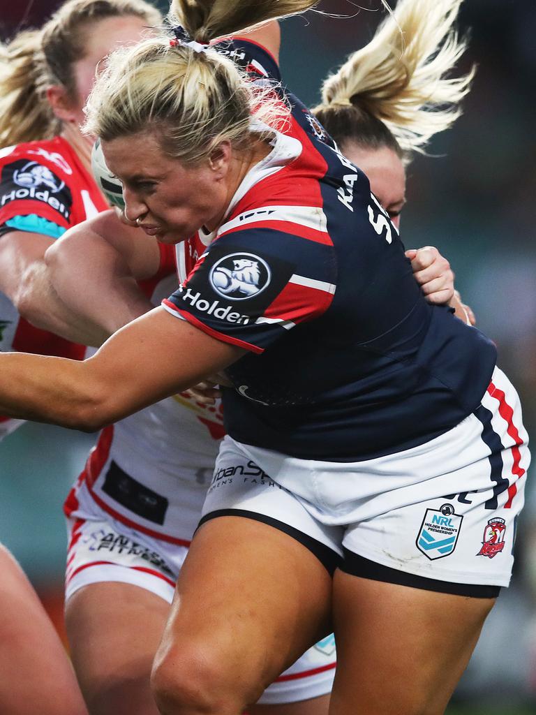 Julia Robinson of the Broncos (right) is tackled by Ruan Sims of the  Roosters during the