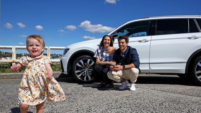 Matty J and partner Laura Byrne pictured with daughter Marlie-Mae and their Volkswagon Tiguan at Bondi. Picture: Toby Zerna