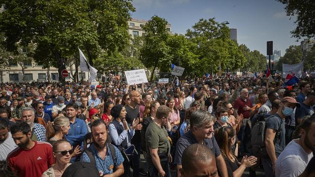 Thousands of anti-vaccine demonstrators march through the streets of Paris in protest to new restrictions announced by Emmanuel Macron. Picture: Getty Images.