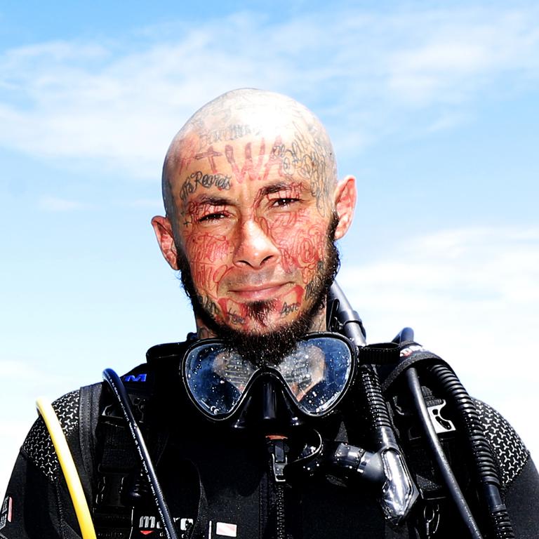 Brisbane local Thomas Lorenzi enjoys a dive off the Gold Coast / Tweed Coast Photo: Scott Powick Newscorp