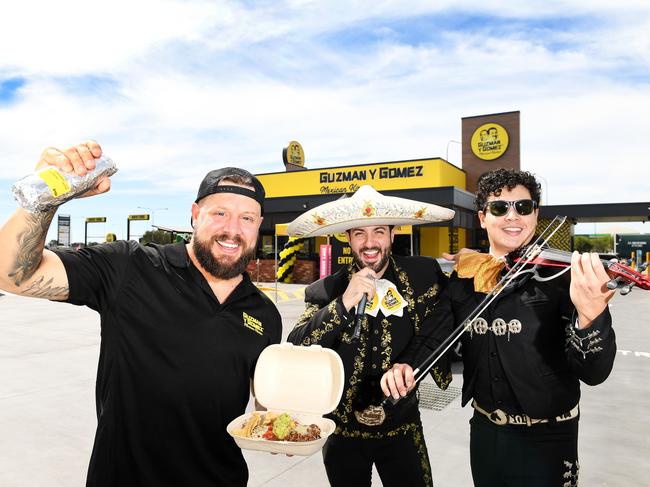 North Queensland operations manager Justin Angus with Sergio and Salvador of GYG Mariachi Band, at the opening of the new Guzman y Gomez restaurant at Fairfield Central. Picture: Shae Beplate.