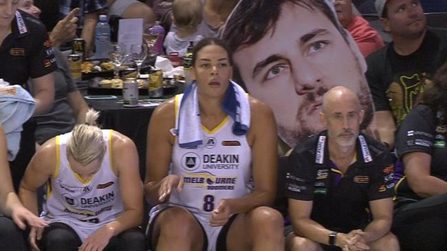Some cheeky Townsville Fire fans behind Liz Cambage.