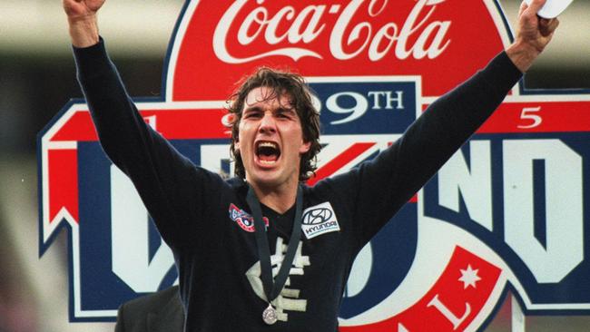 Stephen Silvagni celebrates after the 1995 premiership victory.