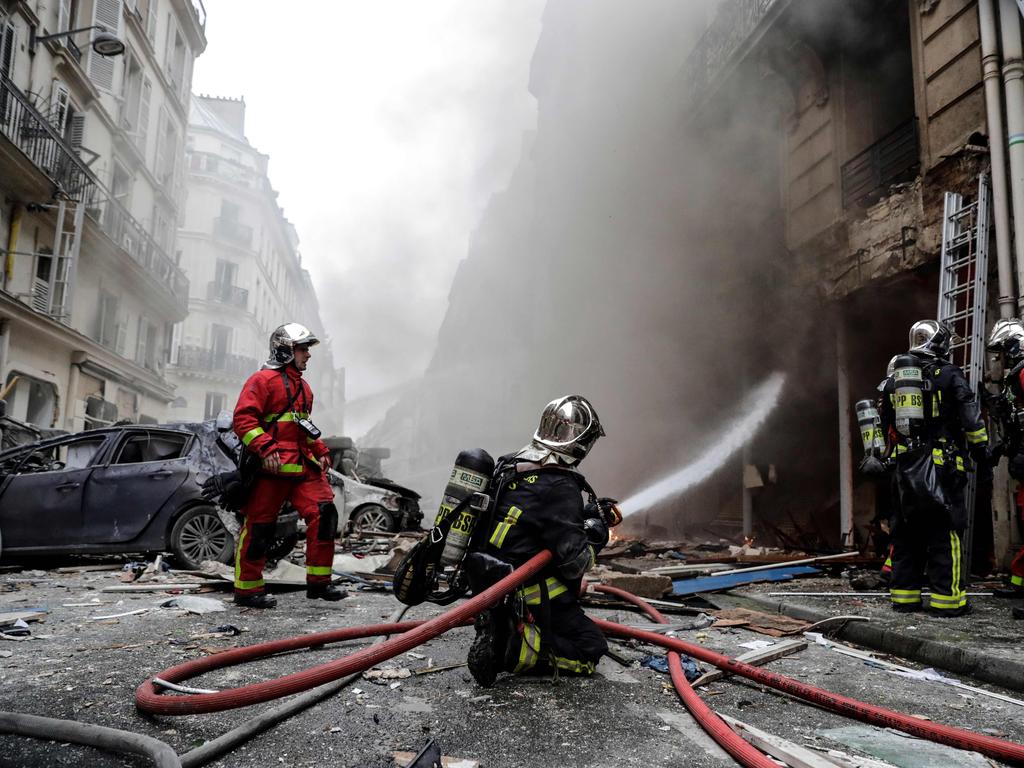 Firefighters extinguish a fire after the explosion of a bakery in Paris. Picture: AFP