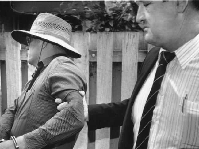 The officer in charge of the Colin Winchester murder investigation, Ric Ninness (right), with David Eastman on the day Mr Eastman was arrested over the 1989 murder of the top cop. Mr Eastman was acquitted at his 2018 retrial.