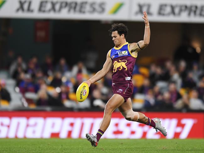 Lions star Cam Rayner kicks a goal at the Gabba. Photo: Albert Perez/Getty Images