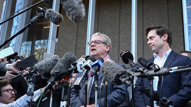 Nine journalists Chris Masters (L) and Nick McKenzie (R) talk to the media outside the Federal Court of Australia.