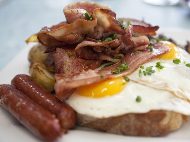 A delicious plate of traditional bacon, fried eggs, sausages and potato rosti on thick sourdough toast. More Food and Drink.