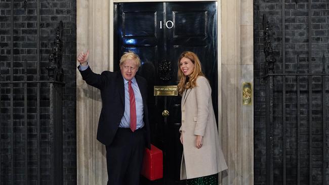 Prime Minister Boris Johnson and his partner Carrie Symonds enter Downing Street. Picture: Getty Images