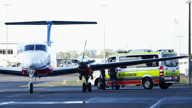 A 51-year-old Brisbane man is transported to Cairns Hospital by Queensland Ambulance Service paramedics after being flown from the Torres Strait to Cairns by the Royal Flying Doctor Service. The man was bitten by a saltwater crocodile in waters near Haggerstone Island, in remote Far North Queensland, and was treated at Thursday Island Hospital before being flown to Cairns. Picture: Brendan Radke